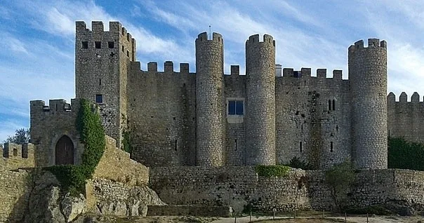 From Lisbon: Private Tour to Obidos, Nazare and Fatima with Drop-off in Porto