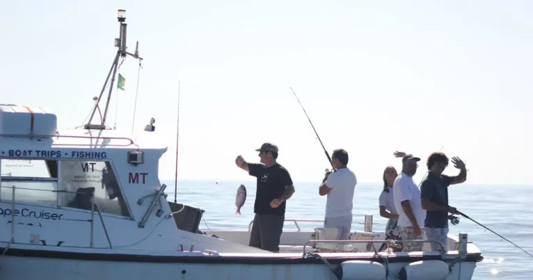 Anglers fishing from the deck of a charter boat