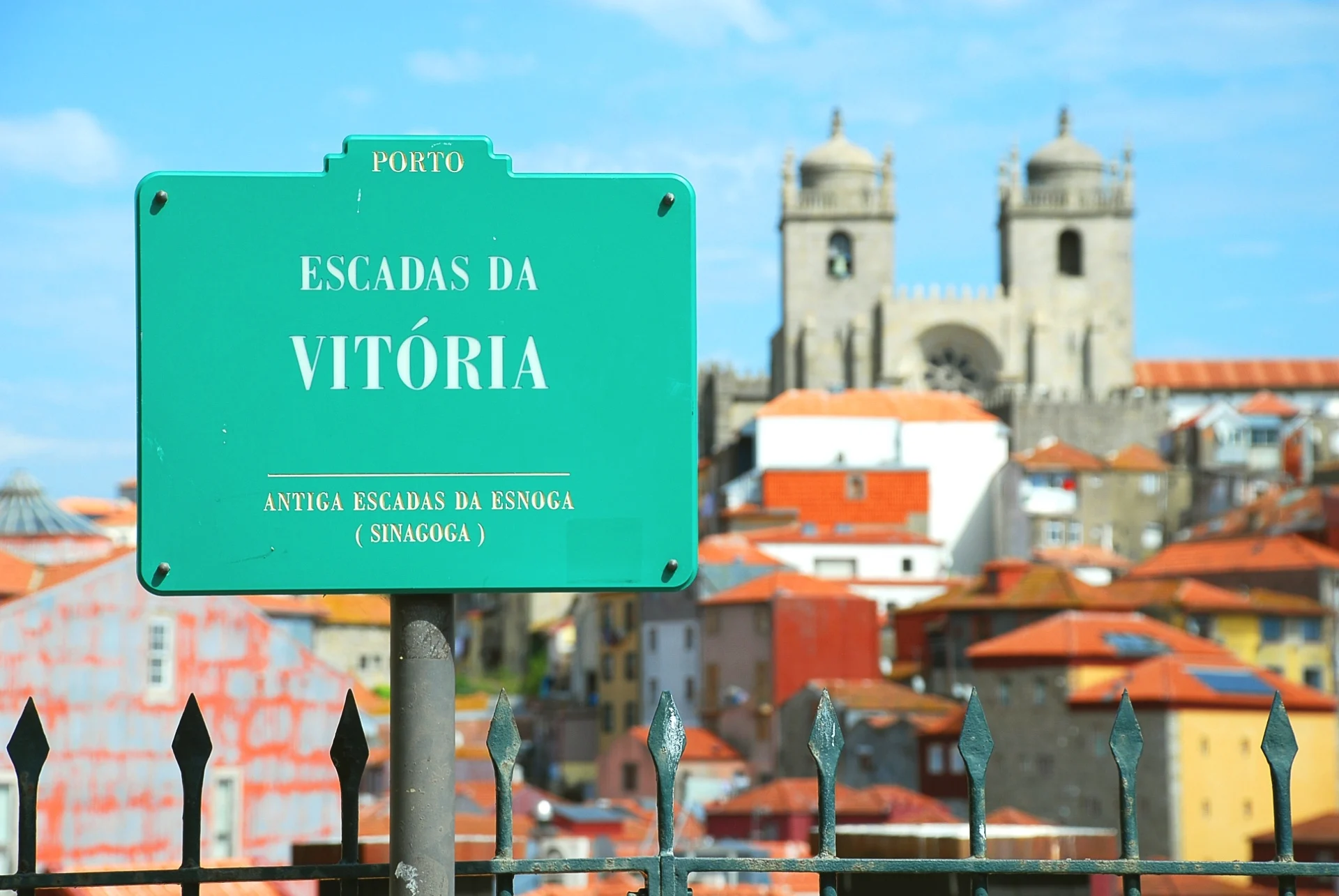 Street sign for the Escadas da Vitória with the Porto Cathedral and rooftops behind